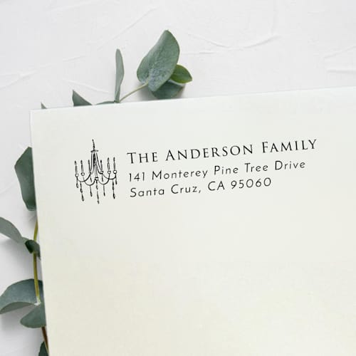This is a black address labels by Samantha Malvey called chandelier address stamp | self inking return address stamp in standard