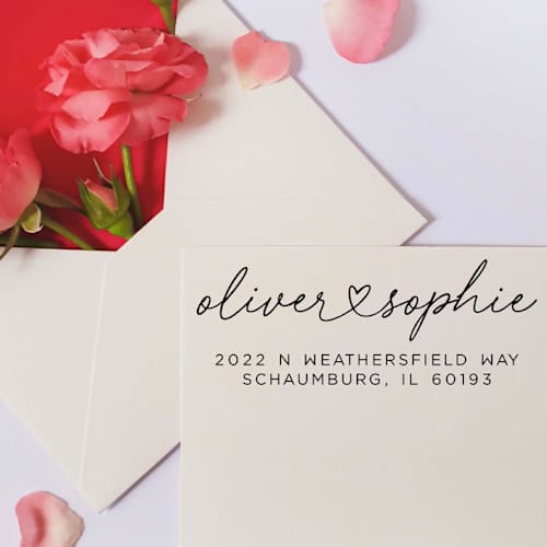 This is a white address labels by Casey Harp called custom heart couple address stamp | self-inking | black ink in standard