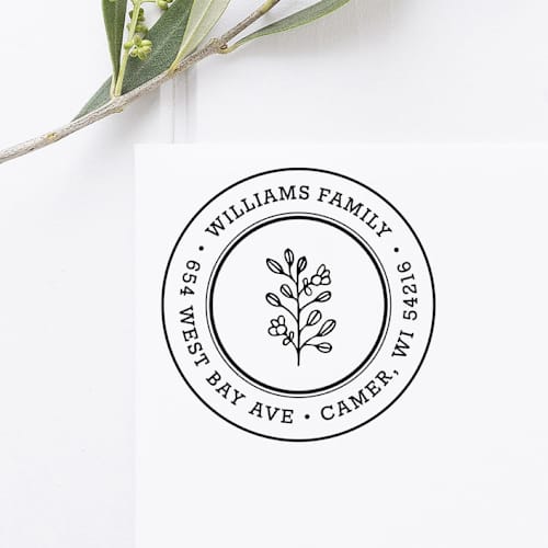 This is a black address labels by Port of Reverie called floral return address stamp, round self inking in standard