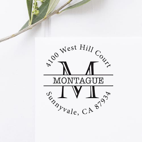 This is a black address labels by Port of Reverie called monogram return address stamp, round self inking in standard