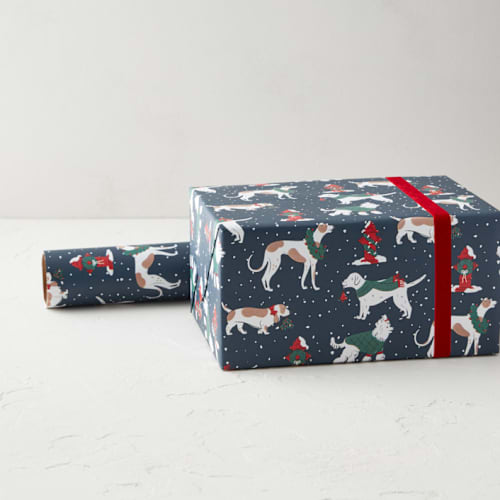 This is a midnight wrapping paper by Kristin Mastoras called snowy dogs strolling in standard