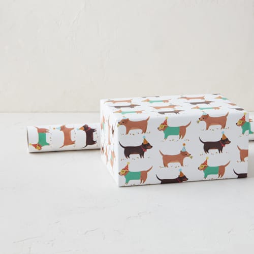 This is a festive wrapping paper by Itsy Belle Studio called party dogs in standard