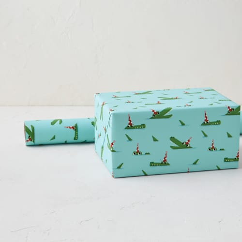 This is a pool wrapping paper by mo kelley called crocodile party in standard