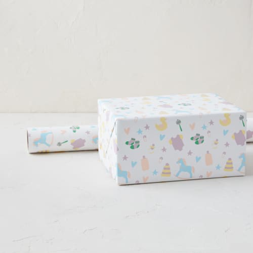 This is a pastels wrapping paper by Chelsea Petaja called baby's trinkets in standard