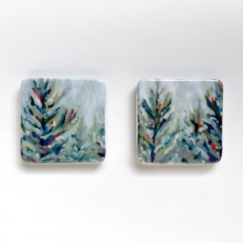 This is a green holiday decorations by Holly Whitcomb called winter woods ceramic magnets: set of 2 in standard
