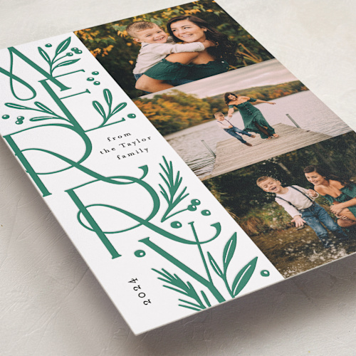 This is a pine letterpress holiday cards with letterpress by Alethea and Ruth called merry letter stack printing on bright white letterpress paper in standard