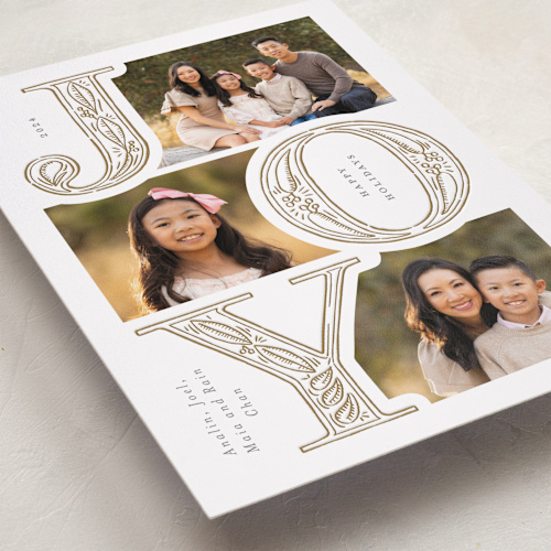 This is a glow letterpress holiday cards with letterpress by Leia Matt called etched joy printing on bright white letterpress paper in standard