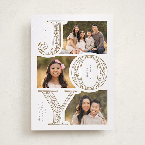 This is a glow letterpress holiday cards with letterpress by Leia Matt called etched joy printing on bright white letterpress paper in standard