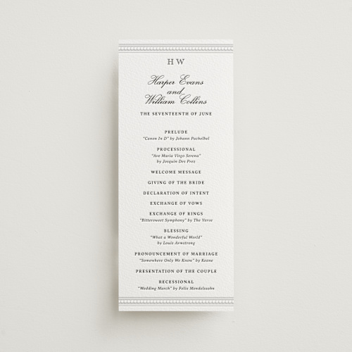 This is a soft black unique wedding programs with letterpress by Jenna Holcomb called the ritz printing on white cotton in 4x9