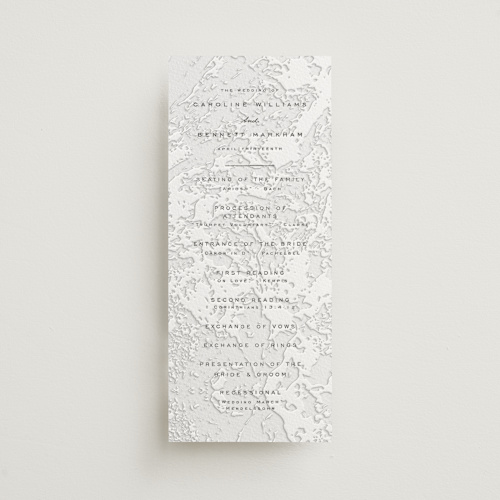 This is a soft black unique wedding programs with letterpress by Erin L. Wilson called subtle marble printing on white cotton in 4x9