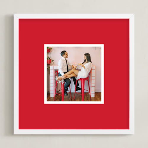 This is a red photo art with standard by Minted called color border: square framed photo