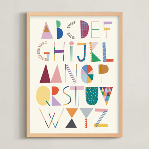 This is a rainbow kids wall art with standard by lulu and isabelle called the most colorful alphabet