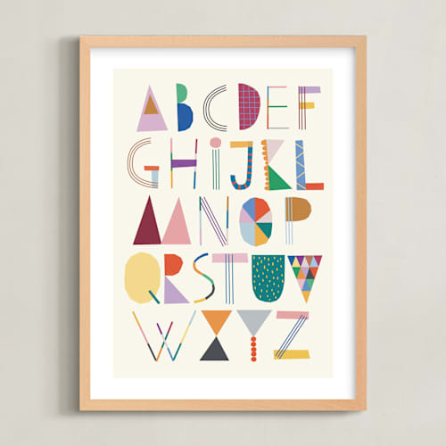 This is a rainbow kids wall art with standard by lulu and isabelle called the most colorful alphabet