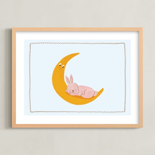 This is a pastel powder blue nursery wall art with standard by Kartika Paramita called sleeping bunny