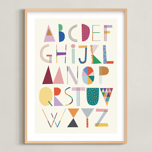 This is a rainbow kids wall art with standard by lulu and isabelle called the most colorful alphabet