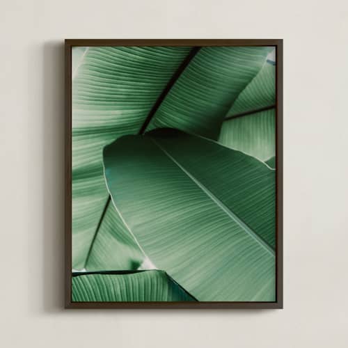 This is a white art with standard by Alicia Abla called tropical leaves