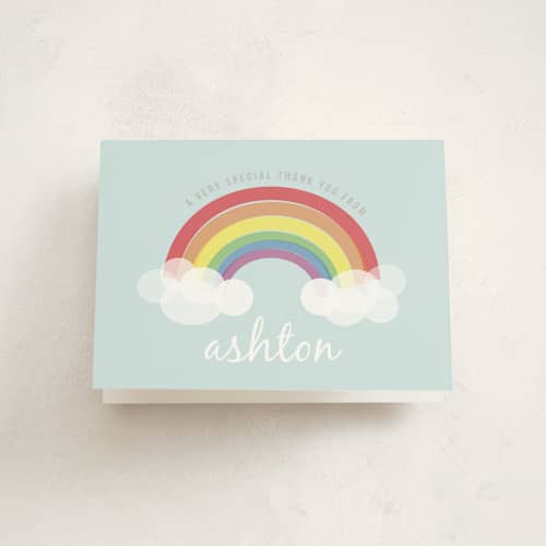 This is a soft teal kids thank you cards with standard by Angela Garrick called rainbow celebration printing on strathmore in standard