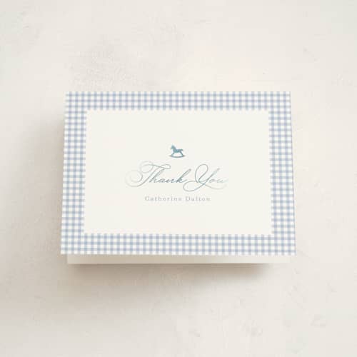 This is a baby blue baby shower thank you cards with foil pressed by Olivia Raufman called gingham rockinghorse printing on strathmore in standard