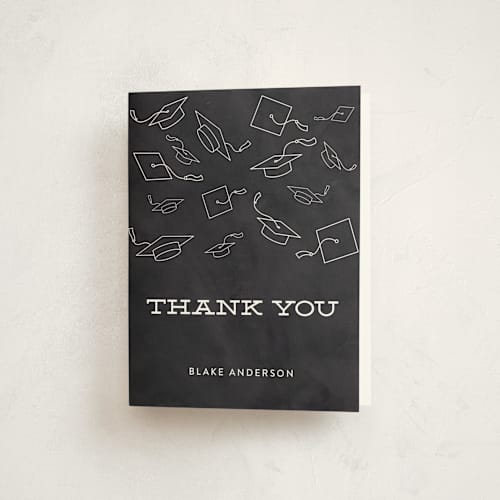 This is a chalkboard graduation thank you cards with standard by Sara Showalter called hats off to the grad printing on strathmore in standard