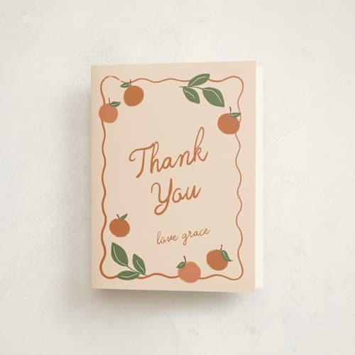 This is a peach baby shower thank you cards with standard by Kelly Watkins called a little cutie printing on strathmore in standard