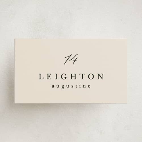 This is a ecru party place cards with standard by Hooray Creative called scripted names printing on signature in placecard