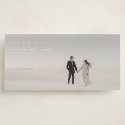 This is a snow foil pressed holiday cards with foil pressed by Olivia Raufman called visage printing on recycled smooth signature in tall