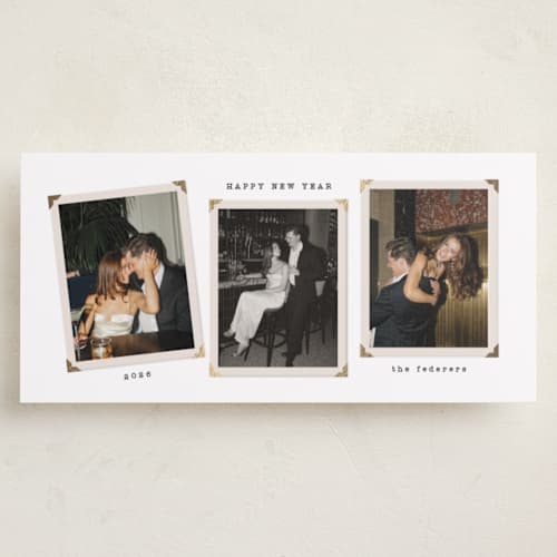 This is a snow foil pressed holiday cards with foil pressed by Tamara Hilje called vintage album printing on recycled smooth signature in tall