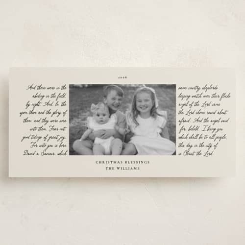 This is a cream holiday photo cards with standard by Robert and Stella called handwritten holiday printing on recycled smooth signature in tall