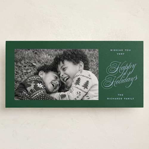 This is a spruce holiday photo cards with standard by Amy Kross called manor printing on recycled smooth signature in tall