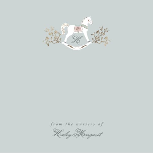 This is a french blue foil stamped stationery with foil pressed by Ana de Sousa called the heirloom rocking horse printing on signature in 4.25x5.5