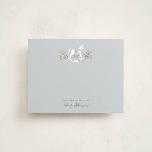 This is a french blue foil stamped stationery with foil pressed by Ana de Sousa called the heirloom rocking horse printing on signature in 4.25x5.5
