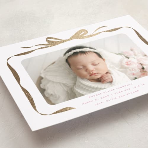 This is a poppy foil stamped birth announcements with foil pressed by Olivia Kanaley Inman called bow printing on recycled smooth signature in standard