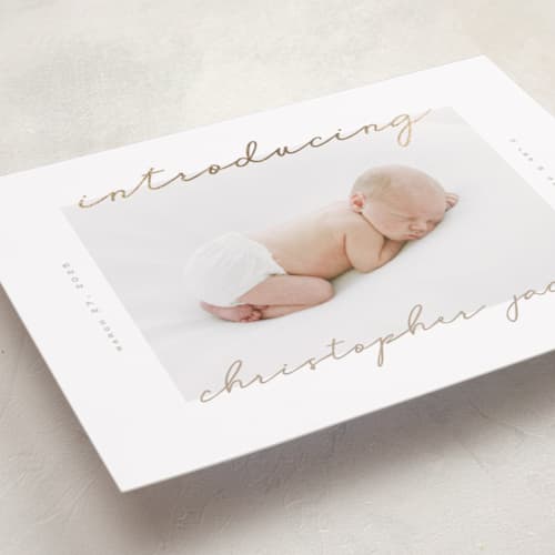 This is a powder foil stamped birth announcements with foil pressed by Creo Study called border script printing on recycled smooth signature in standard