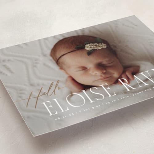 This is a marshmallow foil stamped birth announcements with foil pressed by Everett Paper Goods called cara printing on recycled smooth signature in standard