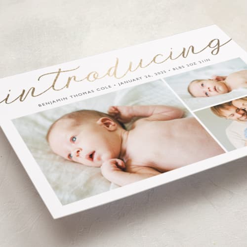 This is a cotton foil stamped birth announcements with foil pressed by Carolyn MacLaren called big introductions printing on recycled smooth signature in standard