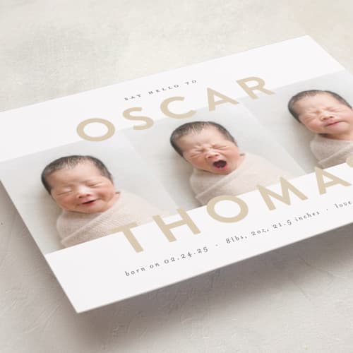 This is a sand birth announcements with standard by Carolyn MacLaren called trio overlay printing on recycled smooth signature in standard