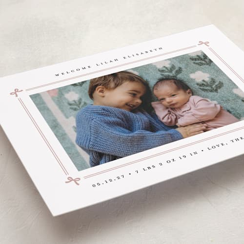 This is a mauve birth announcements with standard by Erica Krystek called bow frame printing on recycled smooth signature in standard
