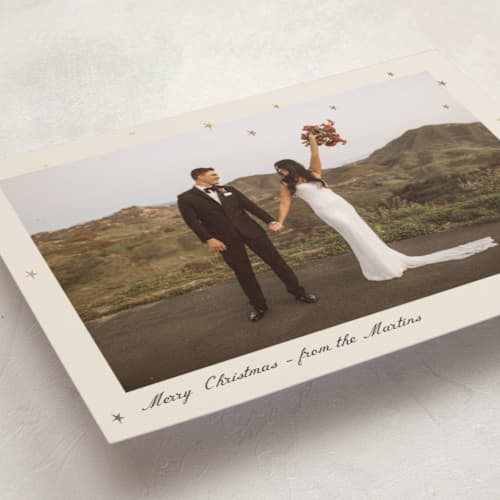 This is a cream foil pressed holiday cards with foil pressed by Ani Somi called star dust printing on recycled smooth signature in standard