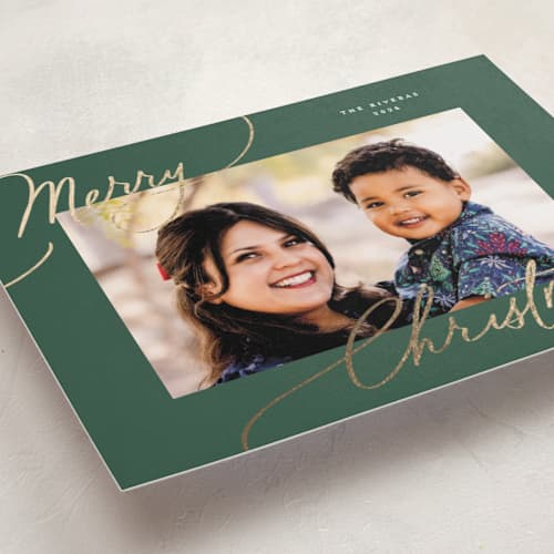 This is a spruce foil pressed holiday cards with foil pressed by Everett Paper Goods called evoke printing on recycled smooth signature in standard