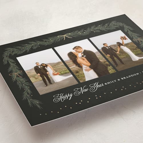 This is a midnight foil pressed holiday cards with foil pressed by Elly called ribbon garland printing on recycled smooth signature in standard