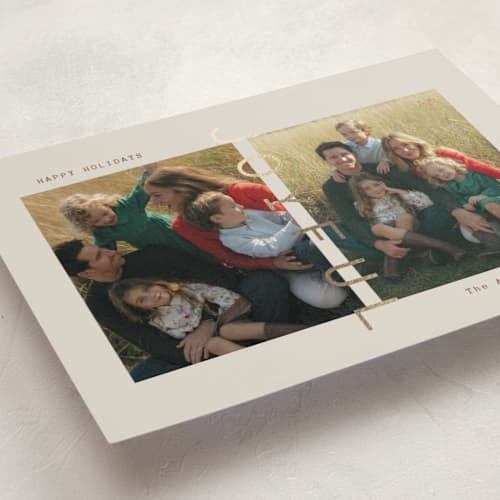This is a linen foil pressed holiday cards with foil pressed by Ana Sharpe called joyful den printing on recycled smooth signature in standard