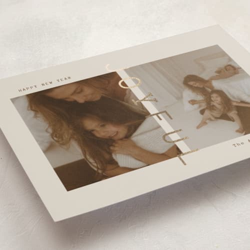 This is a linen foil pressed holiday cards with foil pressed by Ana Sharpe called joyful den printing on recycled smooth signature in standard