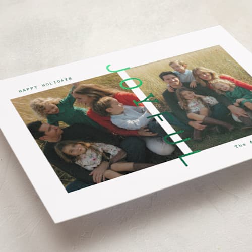 This is a verdant foil pressed holiday cards with foil pressed by Ana Sharpe called joyful den printing on recycled smooth signature in standard