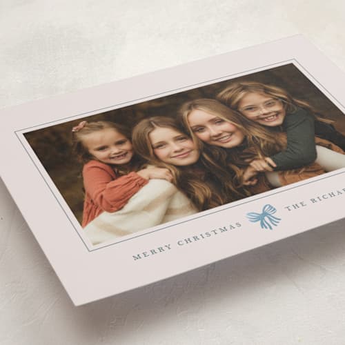 This is a celestial foil pressed holiday cards with foil pressed by Olivia Kanaley Inman called little striped bow printing on recycled smooth signature in standard