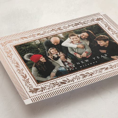 This is a marshmallow foil pressed holiday cards with foil pressed by Laura Hankins called gilt greens printing on recycled smooth signature in standard