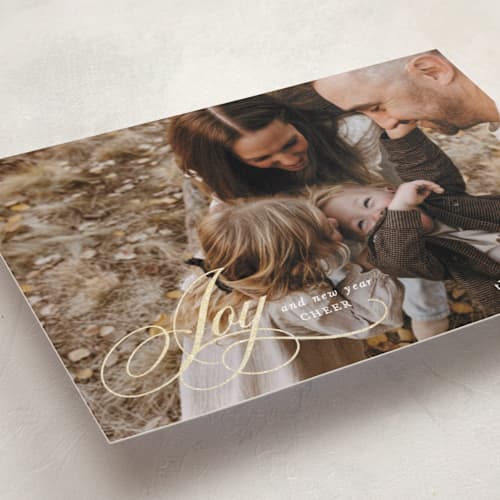 This is a snow foil pressed holiday cards with foil pressed by Mansi Verma called gold scripted joy printing on recycled smooth signature in standard