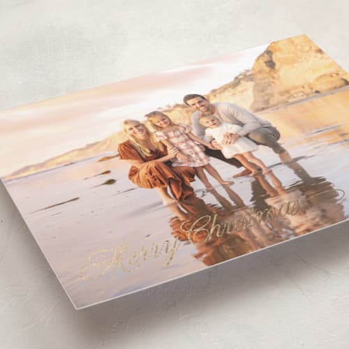 This is a coal foil pressed holiday cards with foil pressed by Lucrecia Caporale called classic script greeting printing on recycled smooth signature in standard
