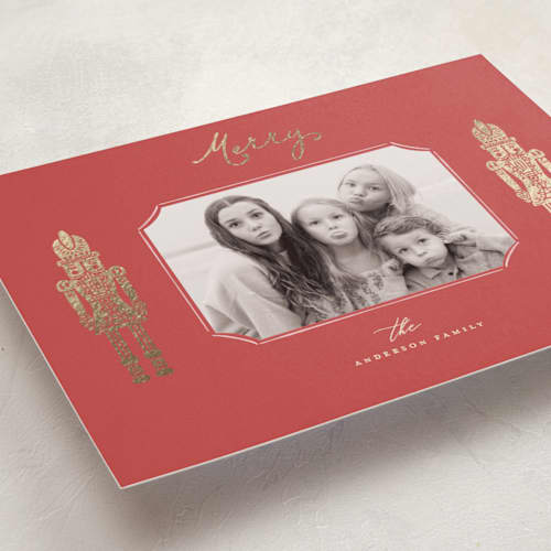 This is a holly berry foil pressed holiday cards with foil pressed by Anne Ciotola called golden nutcrackers printing on recycled smooth signature in standard