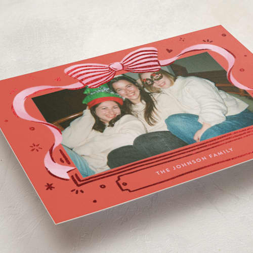 This is a stocking foil pressed holiday cards with foil pressed by Shannon Chen of Four Wet Feet Studio called a bow printing on recycled smooth signature in standard