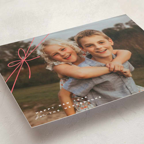 This is a birch foil pressed holiday cards with foil pressed by Leia Matt called tied with joy printing on recycled smooth signature in standard